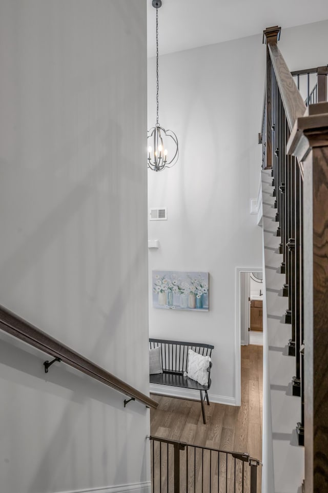 1912 Tidewater Flt, Lexington, KY 40509 - stairway with wood finished floors and a chandelier