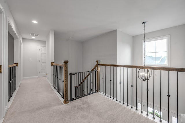 1912 Tidewater Flt, Lexington, KY 40509 - corridor featuring an upstairs landing, a chandelier, light colored carpet, and recessed lighting