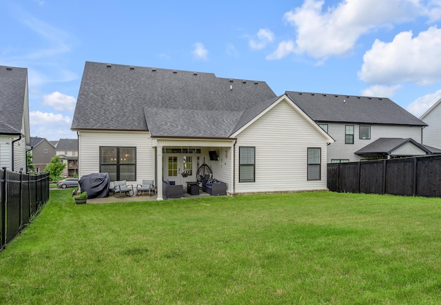 1912 Tidewater Flt, Lexington, KY 40509 - rear view of house featuring an outdoor hangout area, a patio area, a fenced backyard, and a shingled roof