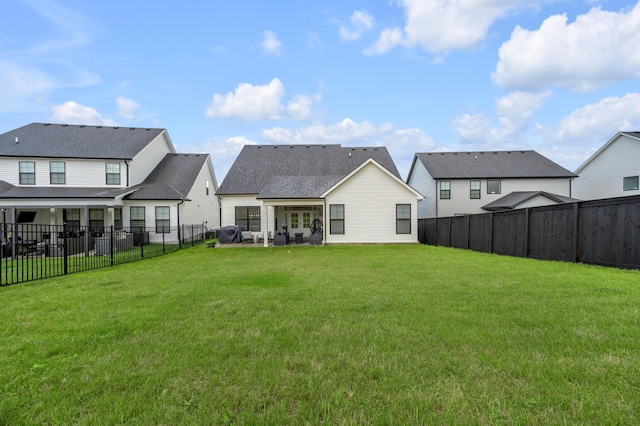 1912 Tidewater Flt, Lexington, KY 40509 - rear view of property with a fenced backyard, a residential view, and a patio area