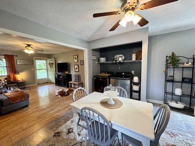 120 Lanetown Rd, Nancy, KY 42544 - dining space with washer and clothes dryer, a ceiling fan, a textured ceiling, and wood finished floors