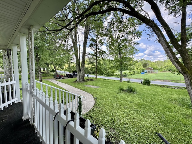 120 Lanetown Rd, Nancy, KY 42544 - view of green lawn with covered porch and view of wooded area