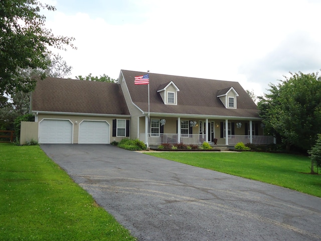 407 Autumn Dr, Lancaster, KY 40444 - cape cod-style house featuring a garage, covered porch, asphalt driveway, and a front lawn