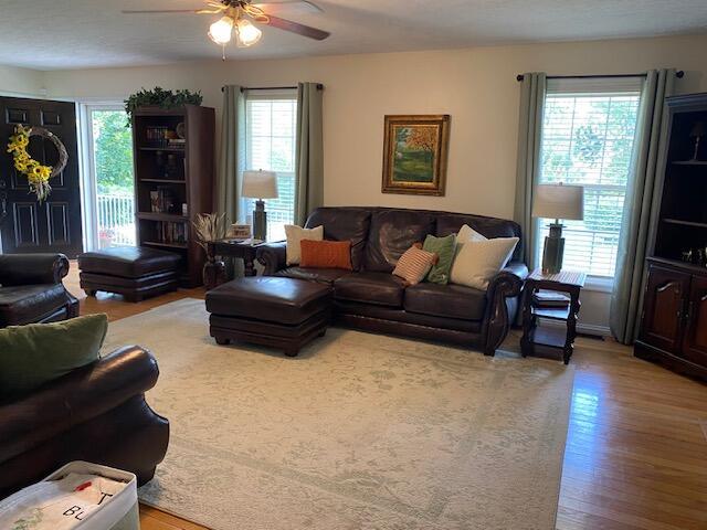 407 Autumn Dr, Lancaster, KY 40444 - living room with healthy amount of natural light, wood finished floors, and ceiling fan