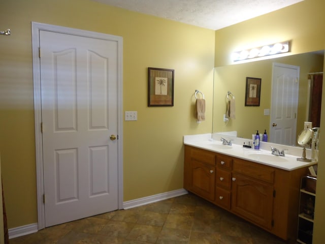 407 Autumn Dr, Lancaster, KY 40444 - bathroom featuring double vanity and baseboards