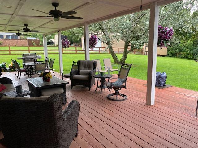 407 Autumn Dr, Lancaster, KY 40444 - deck with outdoor dining space, ceiling fan, a lawn, and an outdoor living space