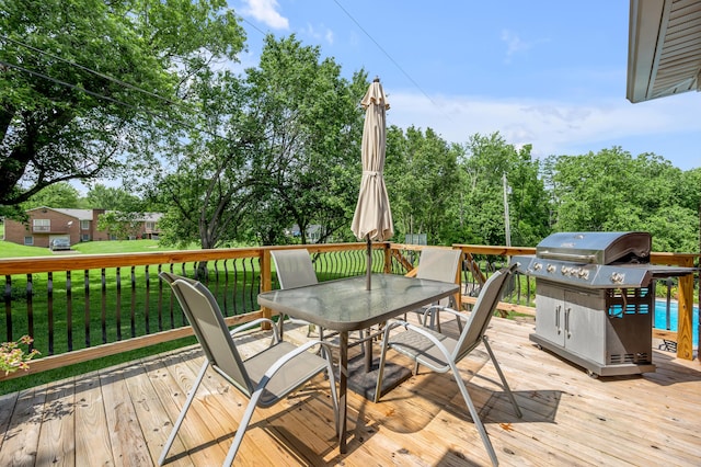 315 The Woods Ln, Winchester, KY 40391 - wooden deck featuring a grill, outdoor dining space, a yard, and view of wooded area