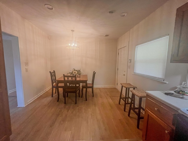 1185 Oak Ridge Rd, Corbin, KY 40701 - dining space featuring light wood-style floors and a chandelier