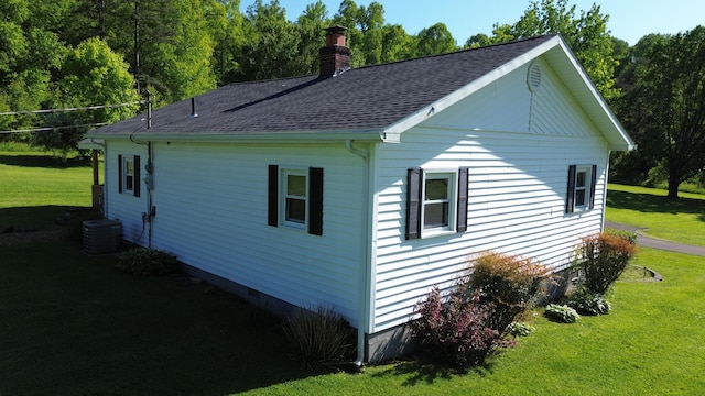 1185 Oak Ridge Rd, Corbin, KY 40701 - view of side of home featuring a chimney, a yard, and roof with shingles