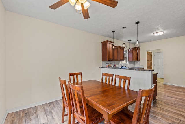 332 Weslyn Way, Nicholasville, KY 40356 - dining space with light wood-type flooring, ceiling fan, and a textured ceiling