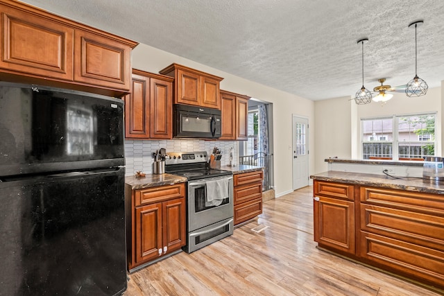 332 Weslyn Way, Nicholasville, KY 40356 - kitchen with black appliances, brown cabinets, backsplash, ceiling fan, and plenty of natural light