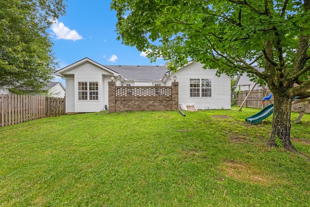 332 Weslyn Way, Nicholasville, KY 40356 - rear view of property featuring a fenced backyard, a playground, and brick siding