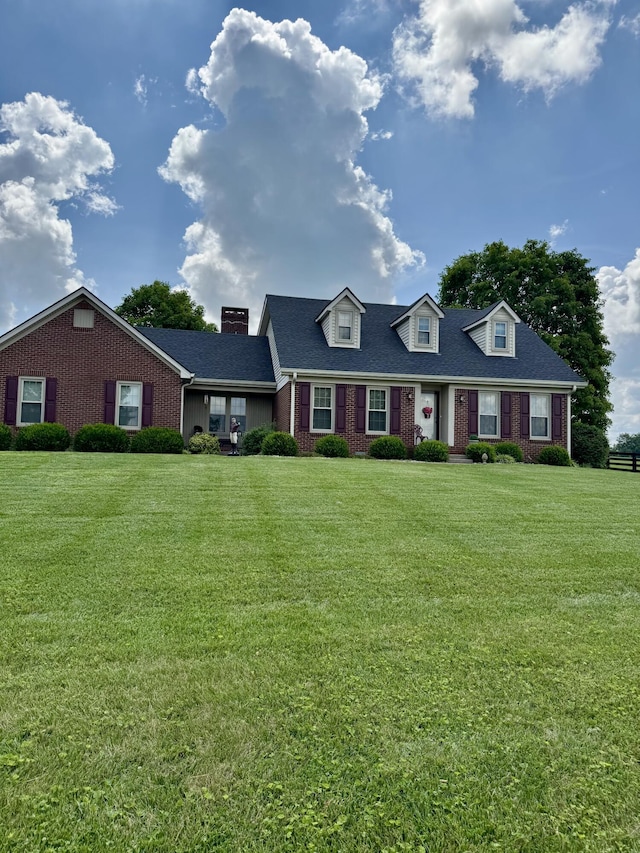 4295 Vince Rd, Nicholasville, KY 40356 - view of front of house featuring brick siding, a front yard, and a chimney
