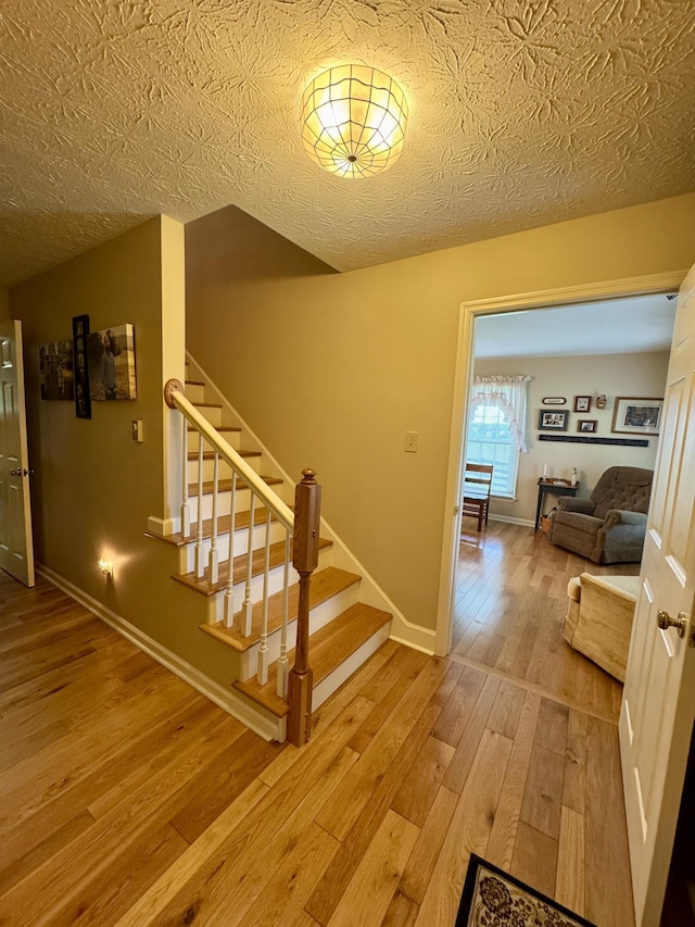 4295 Vince Rd, Nicholasville, KY 40356 - stairs featuring hardwood / wood-style floors and baseboards