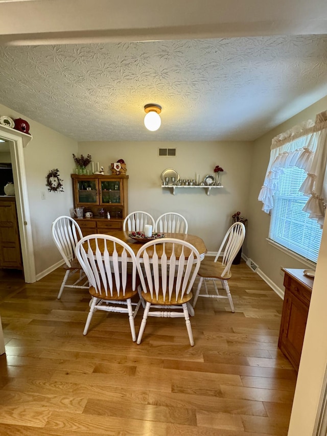 4295 Vince Rd, Nicholasville, KY 40356 - dining room with light wood finished floors and a textured ceiling