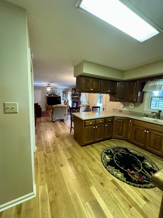 4295 Vince Rd, Nicholasville, KY 40356 - kitchen with open floor plan, light countertops, a peninsula, and dark brown cabinetry