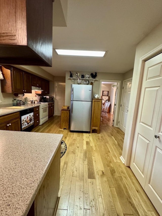 4295 Vince Rd, Nicholasville, KY 40356 - kitchen featuring freestanding refrigerator, white electric stove, light wood-style floors, and light countertops