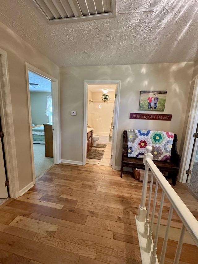 4295 Vince Rd, Nicholasville, KY 40356 - hallway featuring light wood-type flooring and a textured ceiling