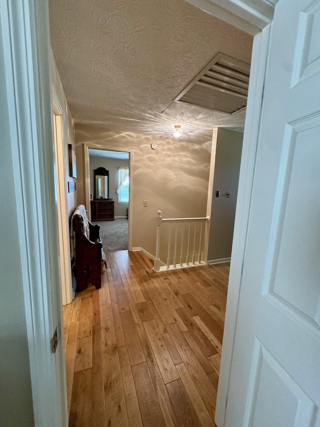 4295 Vince Rd, Nicholasville, KY 40356 - hall with an upstairs landing, a textured ceiling, and light wood finished floors