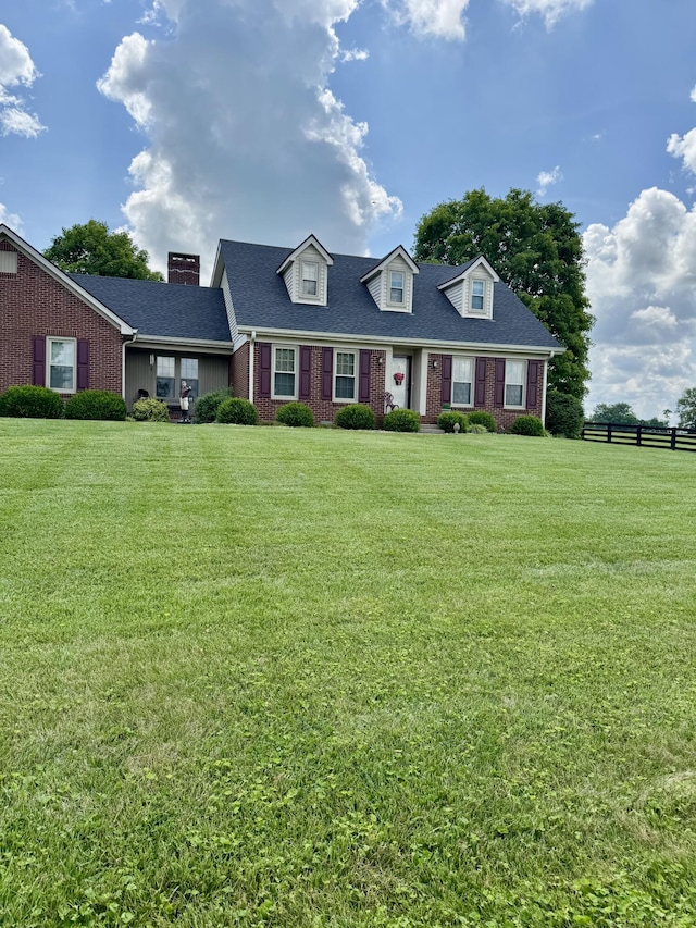 4295 Vince Rd, Nicholasville, KY 40356 - cape cod house with brick siding, a chimney, and roof with shingles