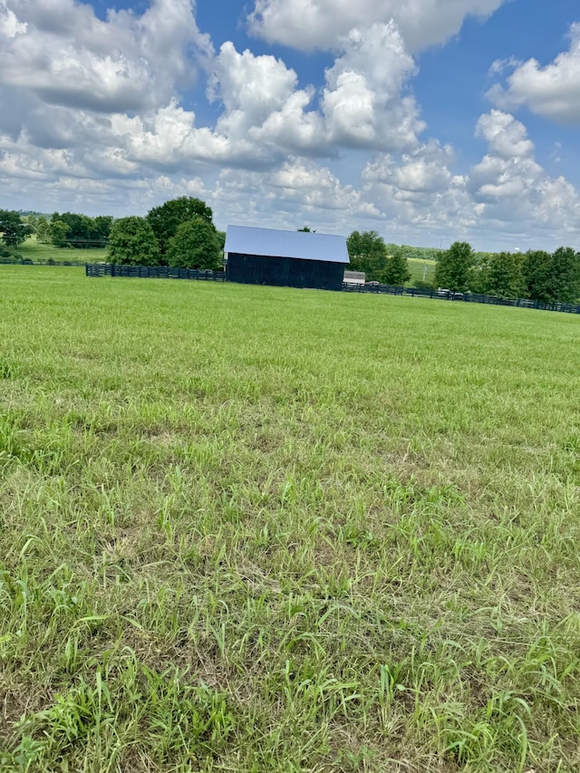 4295 Vince Rd, Nicholasville, KY 40356 - view of grassy yard featuring a view of countryside, a pole building, and an outbuilding