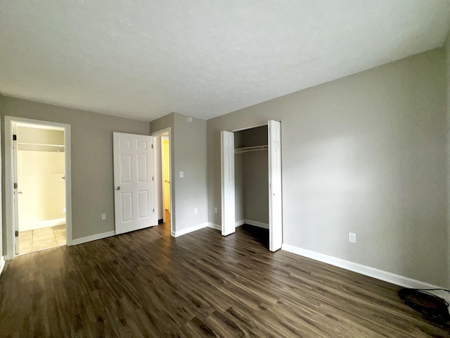 404 Bainbridge Ct Unit E3, Lexington, KY 40509 - unfurnished bedroom with dark wood-type flooring and a closet