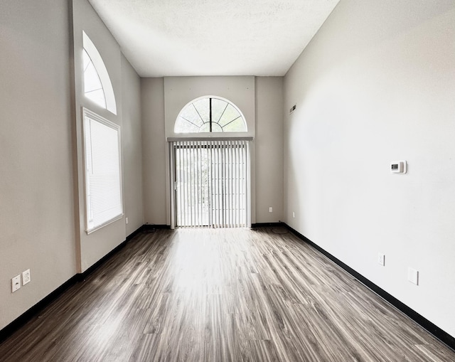 404 Bainbridge Ct Unit E3, Lexington, KY 40509 - empty room with wood finished floors and a textured ceiling