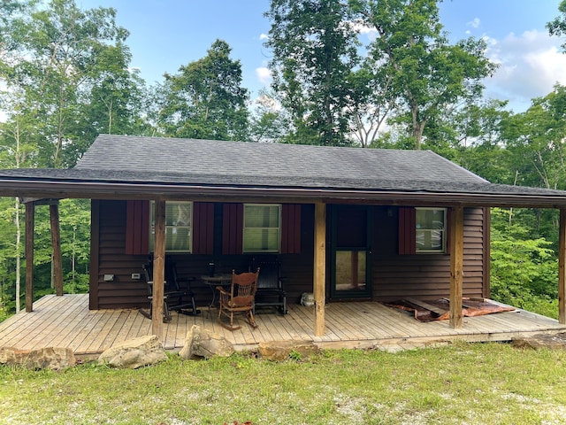 852 Buck Creek Cir, Somerset, KY 42501 - back of property featuring a deck, roof with shingles, and a yard