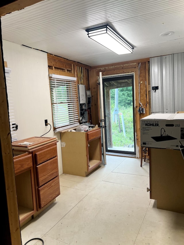 852 Buck Creek Cir, Somerset, KY 42501 - kitchen with wood walls and concrete floors