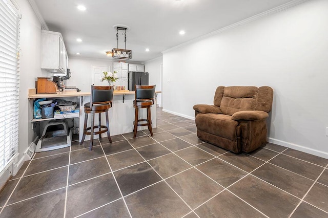 204 Tecumseh Trl, Frankfort, KY 40601 - kitchen with recessed lighting, ornamental molding, white cabinetry, dark tile patterned flooring, and freestanding refrigerator