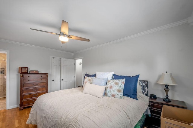 204 Tecumseh Trl, Frankfort, KY 40601 - bedroom featuring light wood-type flooring, a closet, ornamental molding, and a ceiling fan
