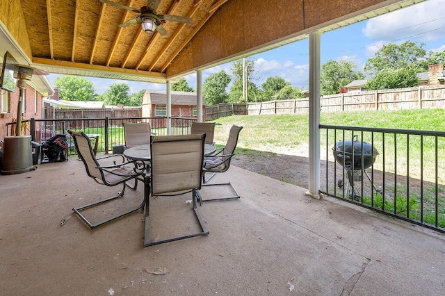 204 Tecumseh Trl, Frankfort, KY 40601 - fenced backyard with ceiling fan, outdoor dining area, a storage unit, and a patio area