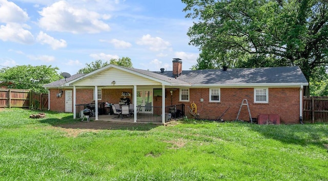 204 Tecumseh Trl, Frankfort, KY 40601 - rear view of house with brick siding, a patio, a fenced backyard, and a chimney