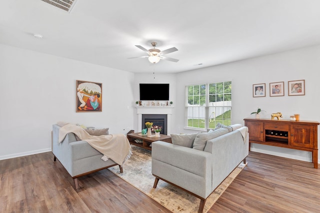 137 Kirkstall Way, Georgetown, KY 40324 - living room featuring wood finished floors, a fireplace, and ceiling fan