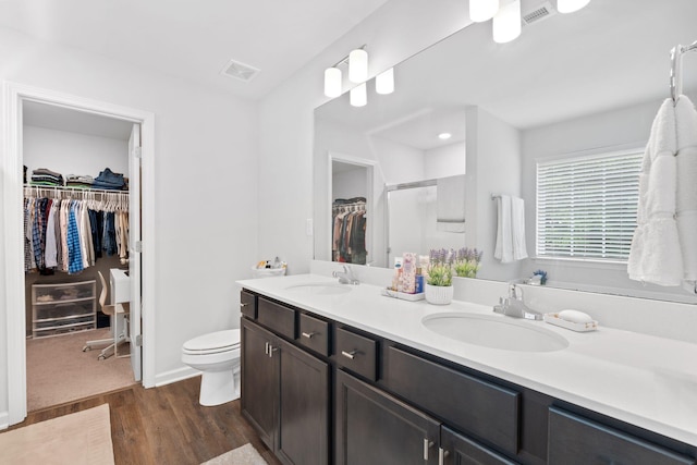 137 Kirkstall Way, Georgetown, KY 40324 - bathroom with a spacious closet, double vanity, wood finished floors, and a shower