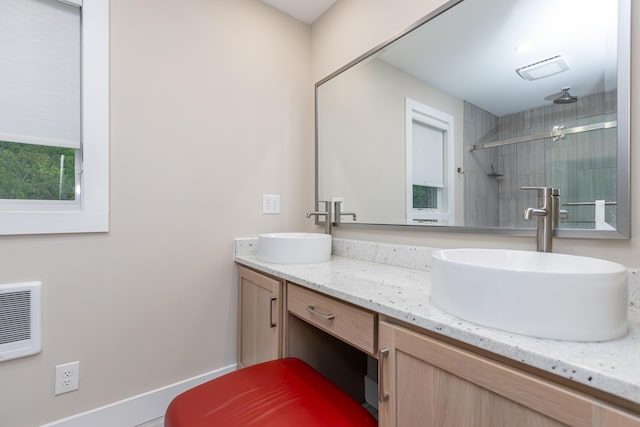 2301 Harrodsburg Rd, Lawrenceburg, KY 40342 - bathroom featuring double vanity, tiled shower, and heating unit