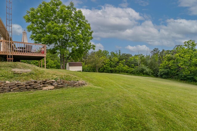 2301 Harrodsburg Rd, Lawrenceburg, KY 40342 - view of green lawn with a storage unit and a wooden deck