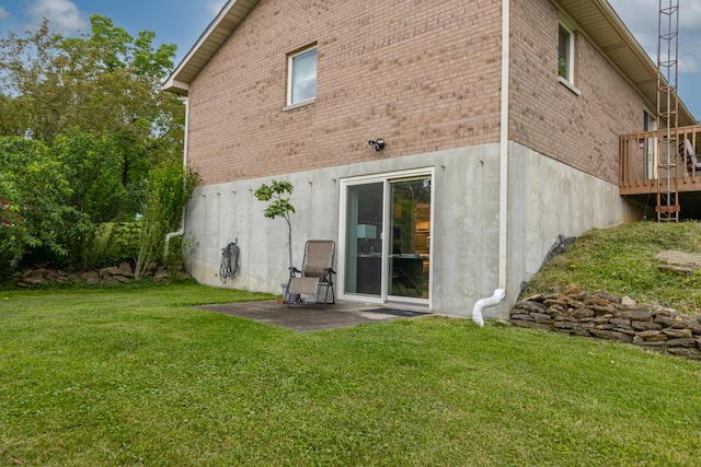 2301 Harrodsburg Rd, Lawrenceburg, KY 40342 - back of property featuring brick siding, a lawn, and a wooden deck