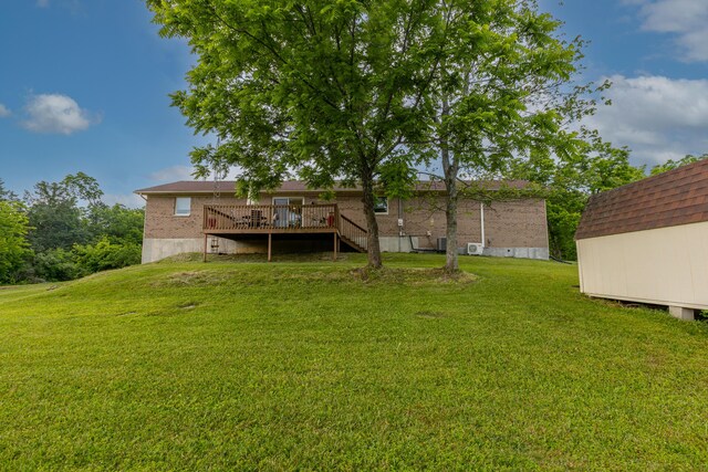 2301 Harrodsburg Rd, Lawrenceburg, KY 40342 - view of grassy yard featuring a wooden deck, a storage shed, and stairs