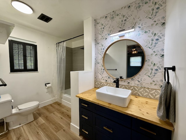 123 Hillandale Dr, Somerset, KY 42501 - bathroom featuring wallpapered walls, wood finished floors, vanity, and shower / bath combination with curtain