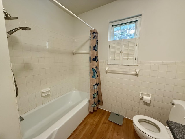 123 Hillandale Dr, Somerset, KY 42501 - bathroom featuring tile walls, wood finished floors, shower / bath combination with curtain, and wainscoting