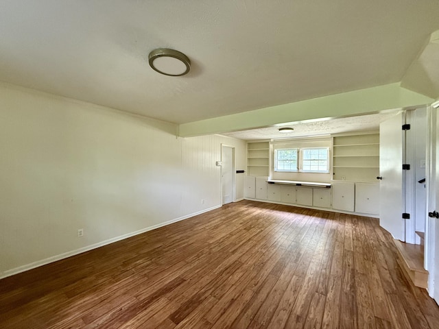 123 Hillandale Dr, Somerset, KY 42501 - unfurnished living room featuring wood finished floors and built in shelves