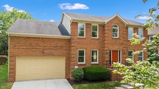 4433 River Ridge Rd, Lexington, KY 40515 - view of front of house with brick siding, concrete driveway, and a shingled roof