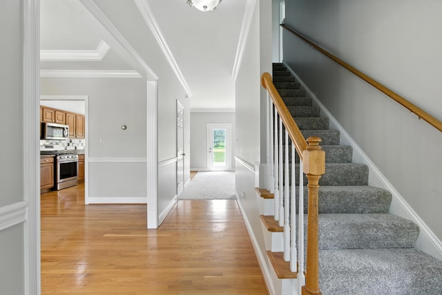 4433 River Ridge Rd, Lexington, KY 40515 - staircase with wood finished floors and crown molding