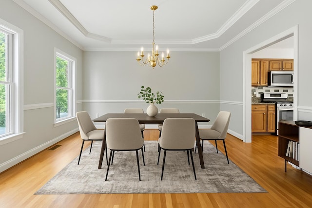 4433 River Ridge Rd, Lexington, KY 40515 - dining space with a chandelier, light wood-type flooring, a tray ceiling, and crown molding