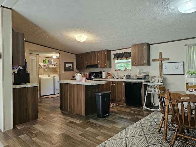421 Dry Branch Rd, Morehead, KY 40351 - kitchen featuring independent washer and dryer, black dishwasher, dark wood finished floors, light countertops, and a center island