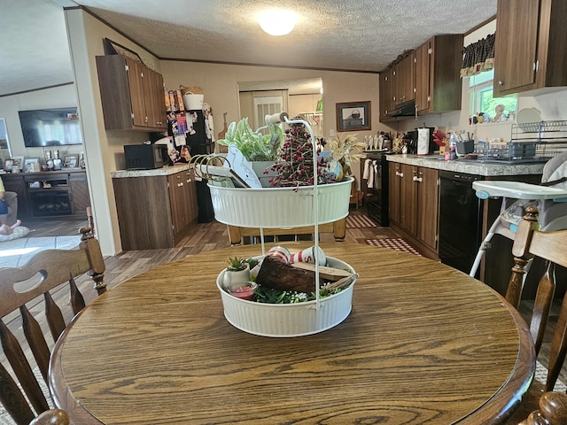 421 Dry Branch Rd, Morehead, KY 40351 - dining space with a textured ceiling and wood finished floors