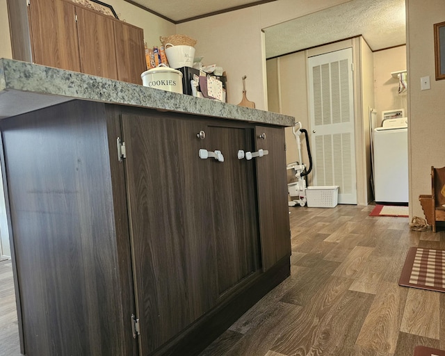 421 Dry Branch Rd, Morehead, KY 40351 - detailed view of washer / dryer, wood finished floors, ornamental molding, and a textured ceiling