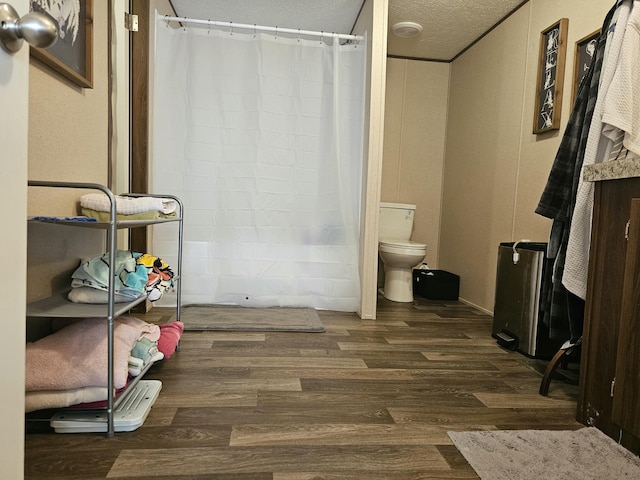 421 Dry Branch Rd, Morehead, KY 40351 - full bathroom with wood finished floors, a textured ceiling, and a shower with curtain
