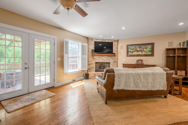 2609 Idlewood Dr, Lexington, KY 40513 - living room with ceiling fan, a stone fireplace, light wood finished floors, french doors, and recessed lighting